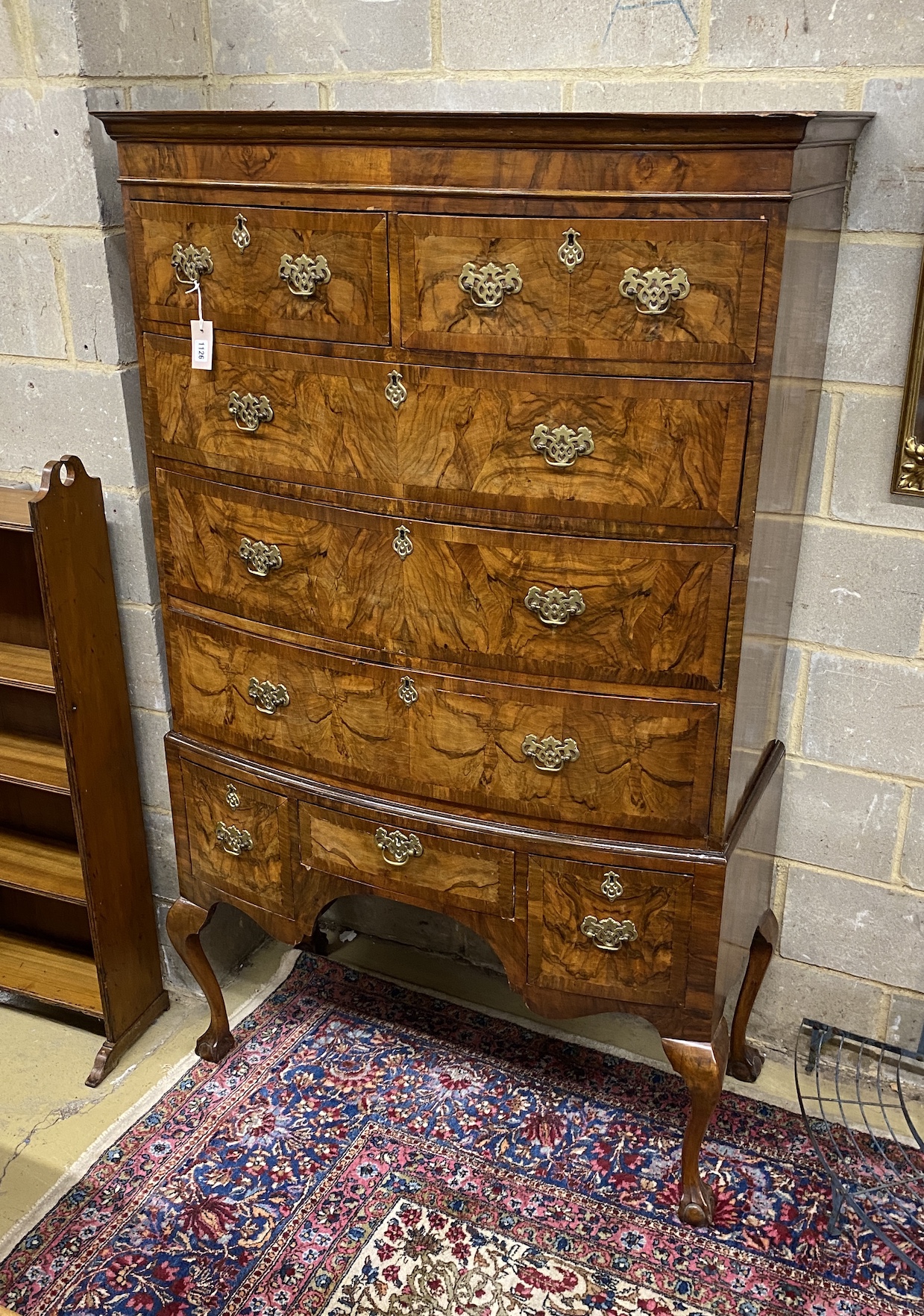 A Queen Anne revival figured walnut bow front chest on stand, width 108cm, depth 54cm, height 178cm